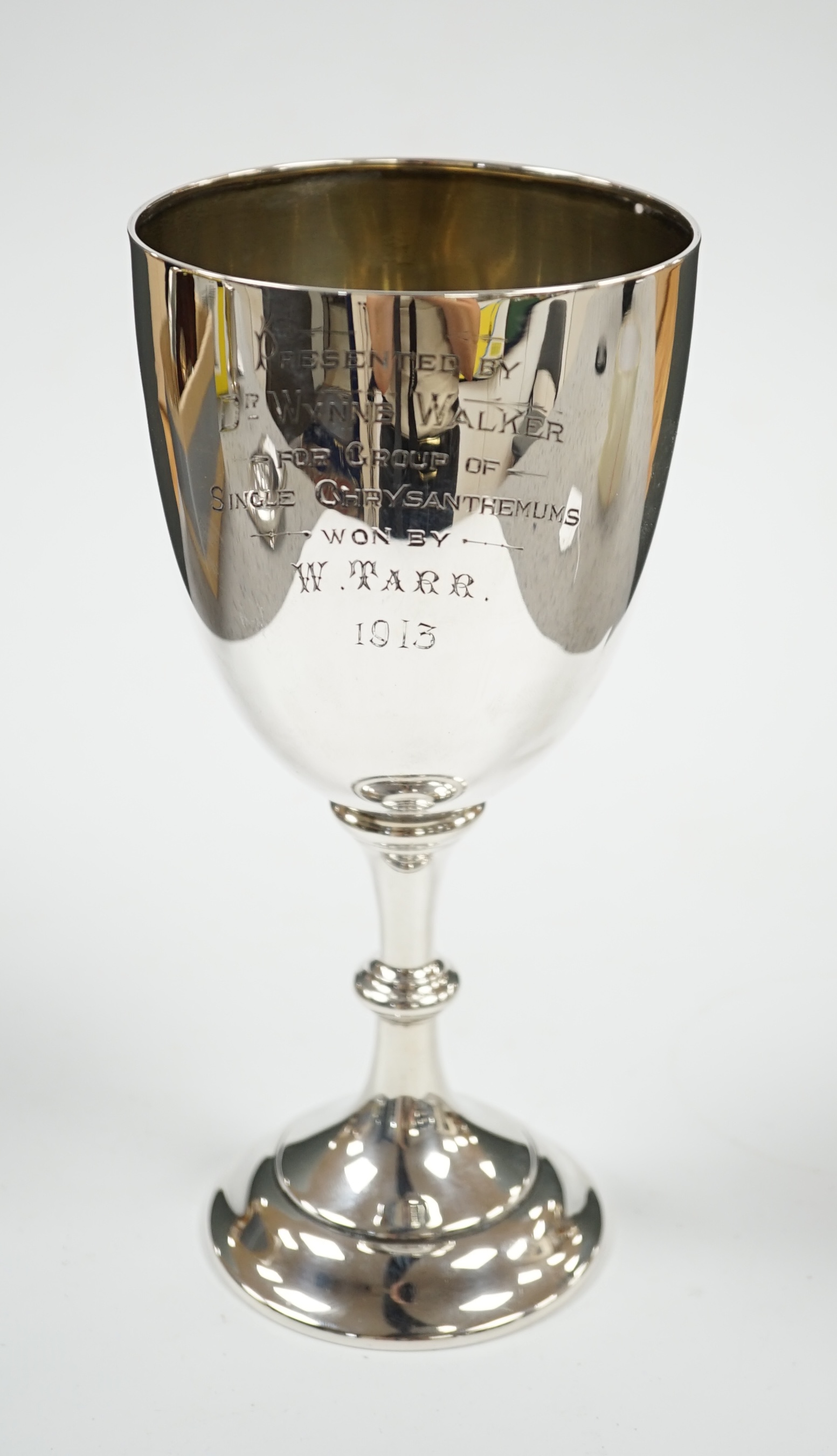 A George V silver goblet, by Charles Stuart Harris & Sons, London 1913, with engraved presentation inscription, 19.2cm, 4.5oz. Condition - fair